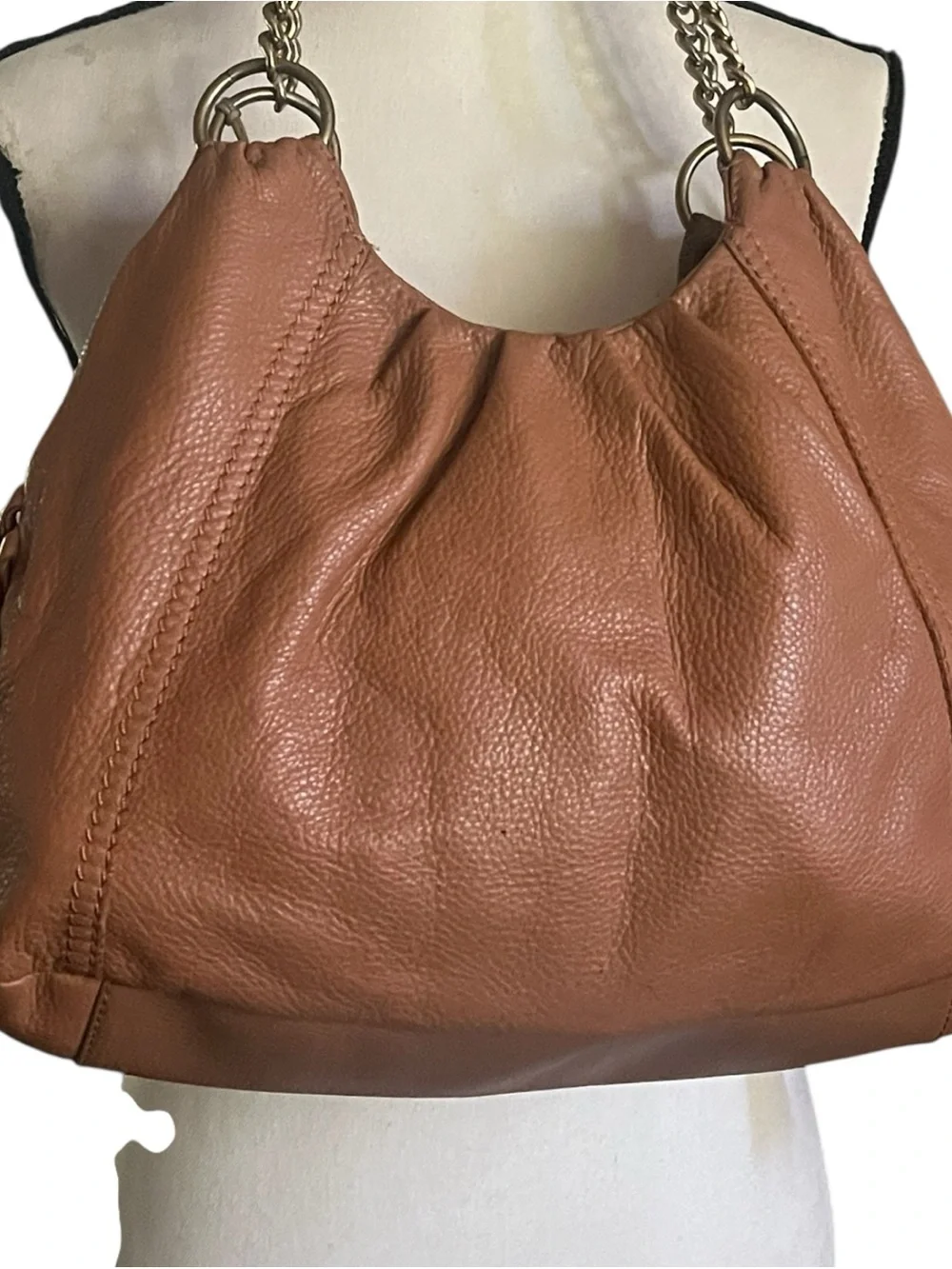 The Sac Pebbled Leather slouchy Hobo Tassel sides  shoulder handbag.
